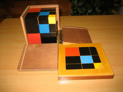 Montessori Trinomial Cube pulling down one side at a time